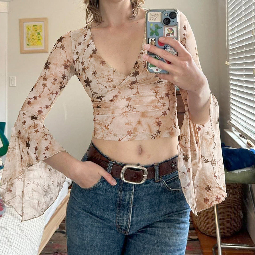 Damen wrap top med voluminösa ärmar och blommig tryck Mirla-Eva Jonsson
