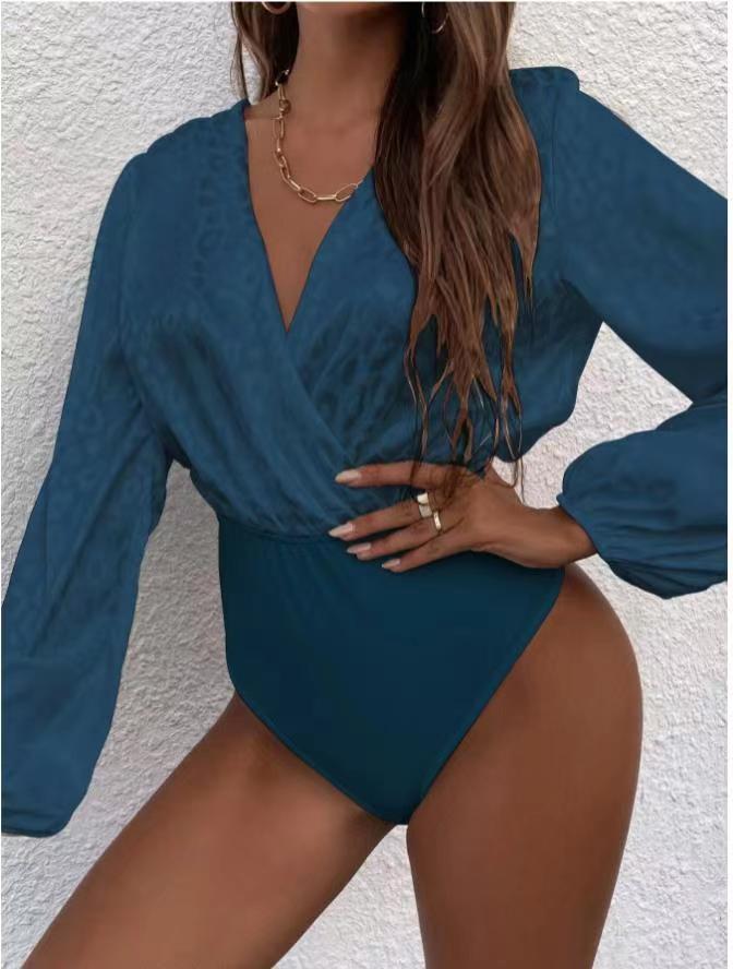 Damenbodysuit med elegant omslagsutskärning och voluminösa ärmar Mirla-Eva Jonsson