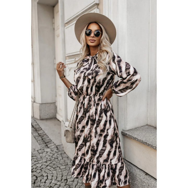 Damens Maxi-klänning med volanger och elastisk midjerem Mirla-Eva Jonsson