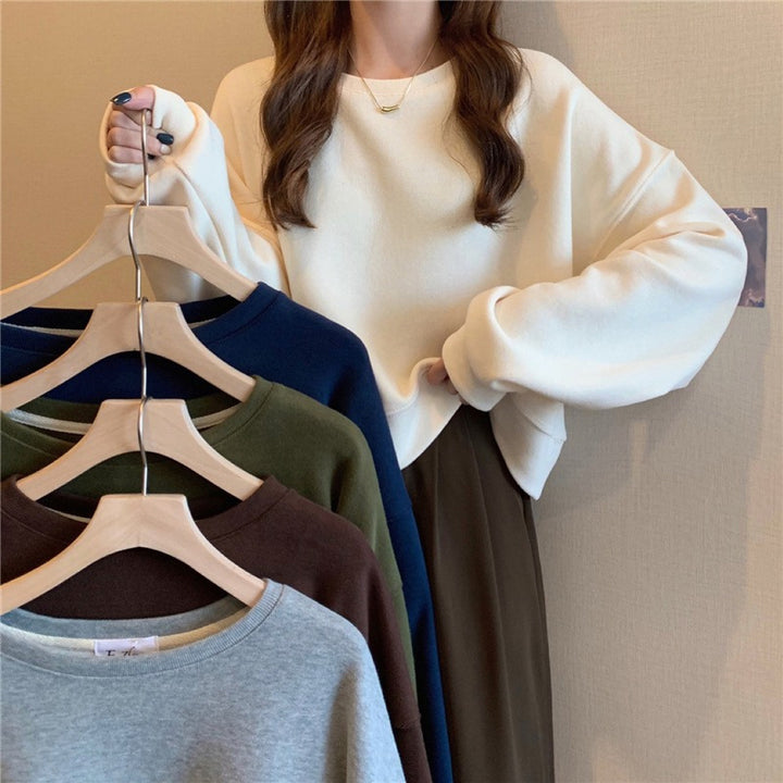 Damens avslappnade oversize sweatshirt med bekväm krage och mjuka muddar-Eva Jonsson