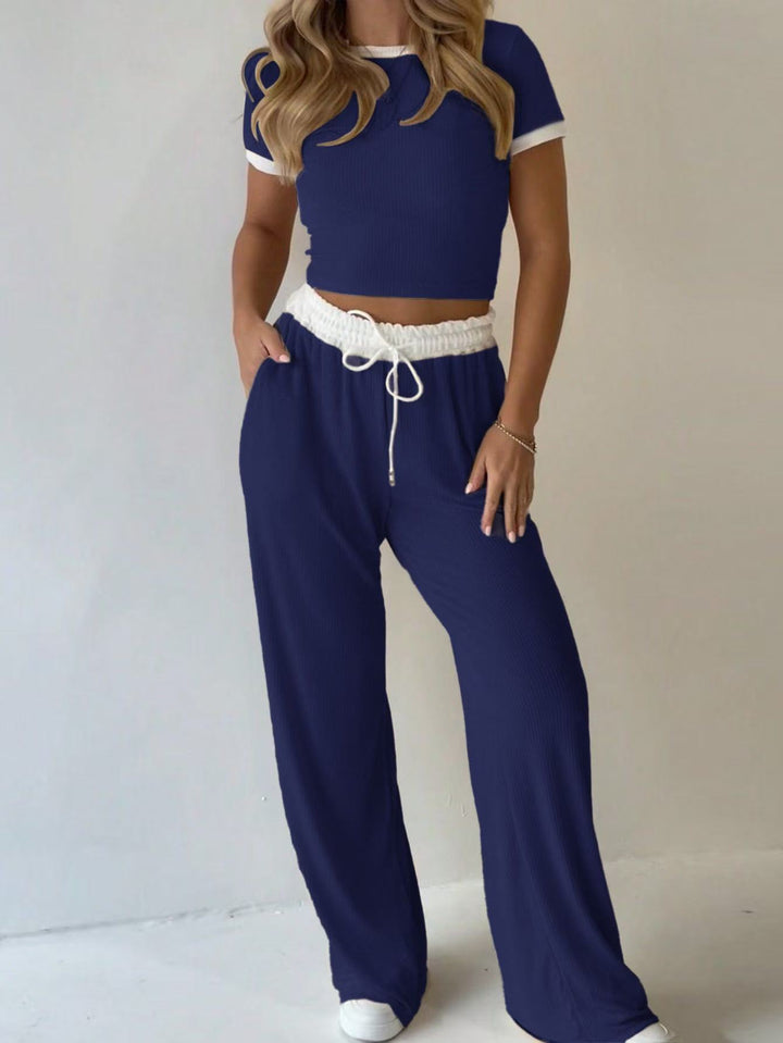 Damens avslappnade tvådelade fritidsset med cropped T-shirt och vida byxor Mirla-Eva Jonsson