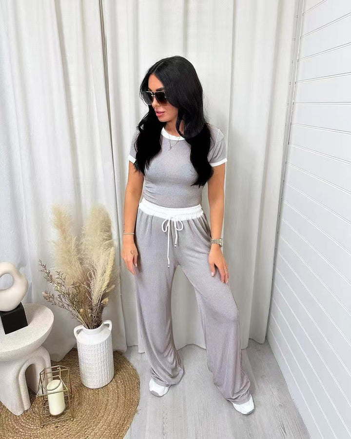 Damens avslappnade tvådelade fritidsset med cropped T-shirt och vida byxor Mirla-Eva Jonsson