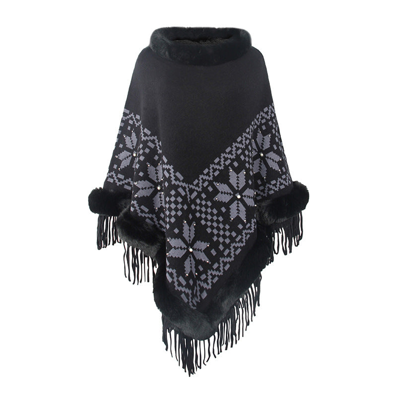 Damens elegant poncho med dekorativt fransdesign och konstpälsdetaljer Mirla-Eva Jonsson