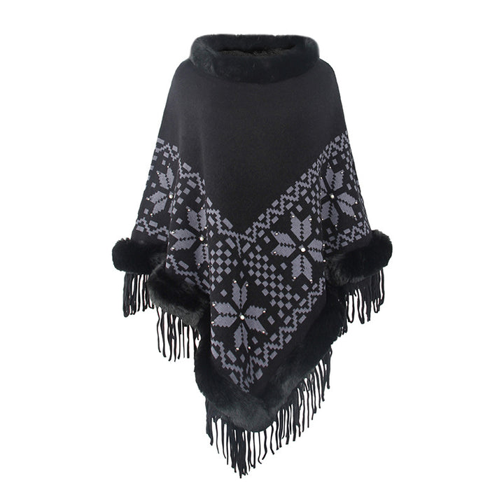 Damens elegant poncho med dekorativt fransdesign och konstpälsdetaljer Mirla-Eva Jonsson
