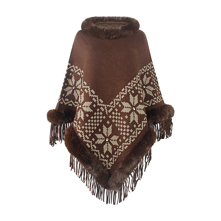 Damens elegant poncho med dekorativt fransdesign och konstpälsdetaljer Mirla-Eva Jonsson