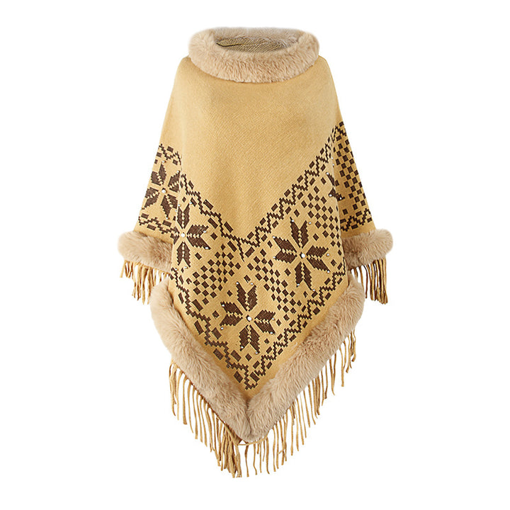Damens elegant poncho med dekorativt fransdesign och konstpälsdetaljer Mirla-Eva Jonsson