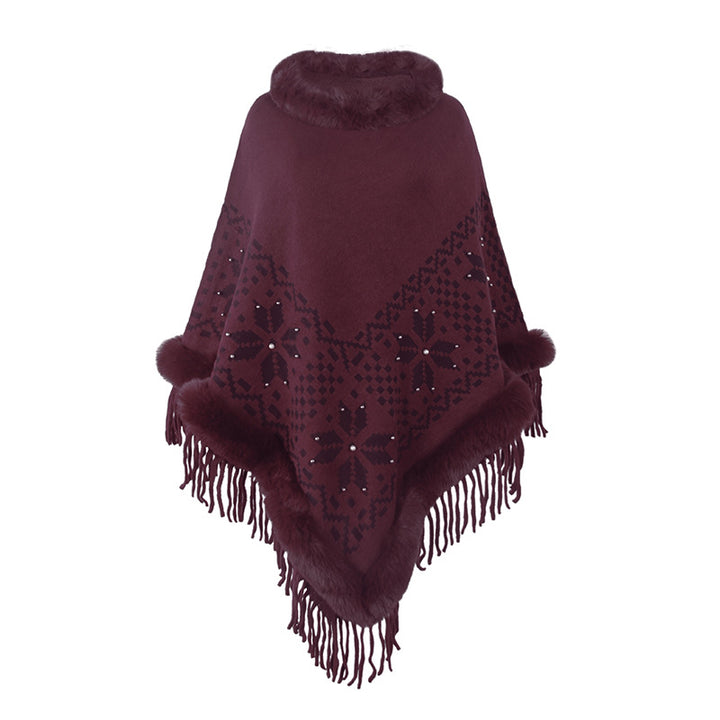Damens elegant poncho med dekorativt fransdesign och konstpälsdetaljer Mirla-Eva Jonsson