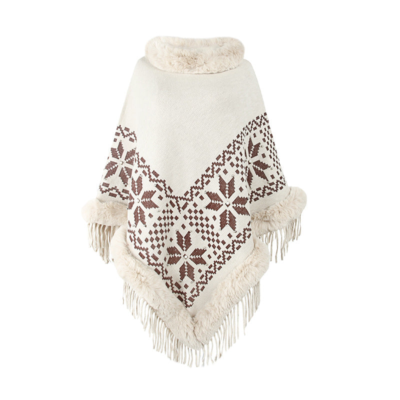Damens elegant poncho med dekorativt fransdesign och konstpälsdetaljer Mirla-Eva Jonsson