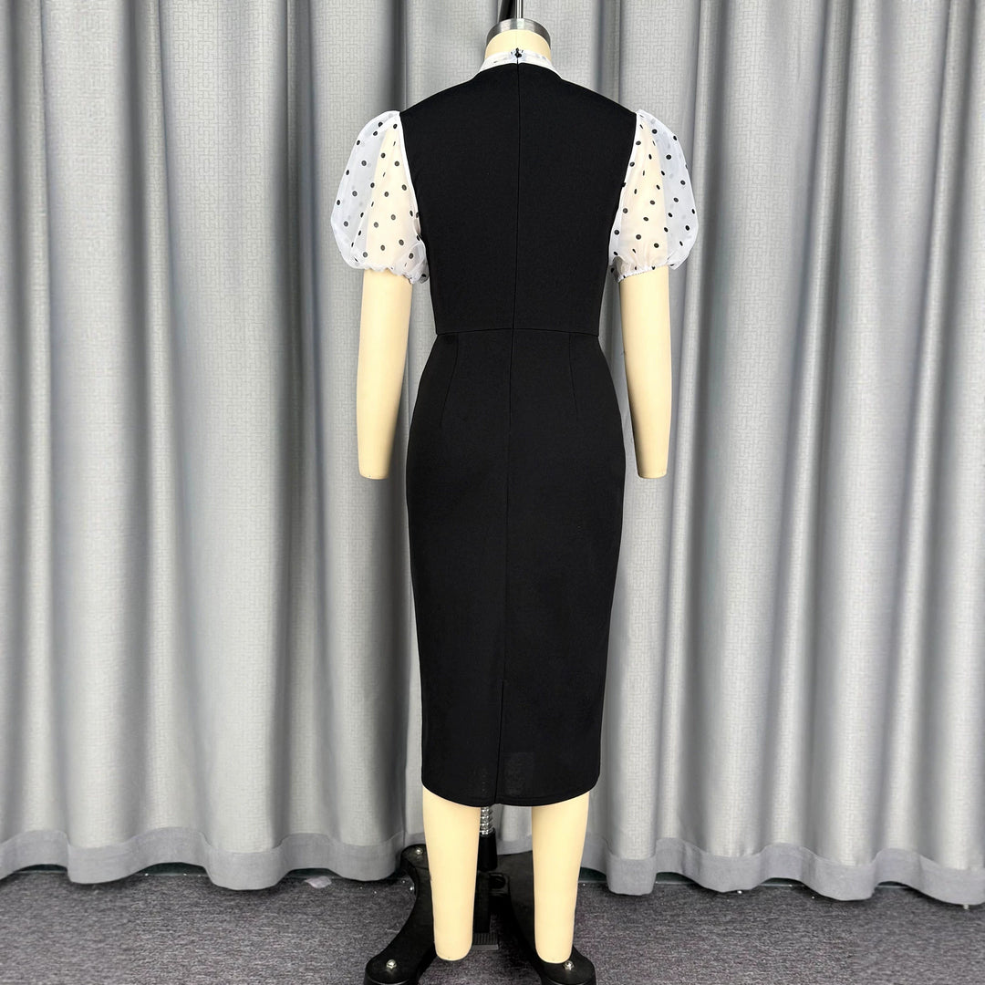 Damens figurnära midi-klänning med transparenta puffärmar och rosettkrage Mirla-Eva Jonsson