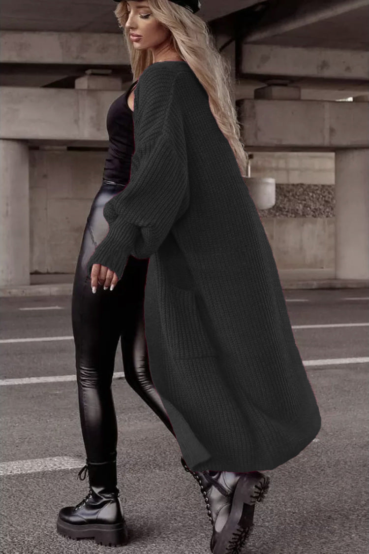 Damens grovstickad kappa i avslappnad oversized stil med djupa fickor Eva Jonsson-Eva Jonsson