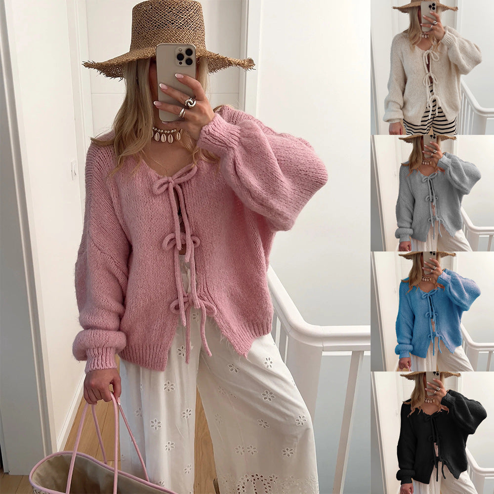 Damens knälång stickad cardigan med dragsko Mirla-Eva Jonsson