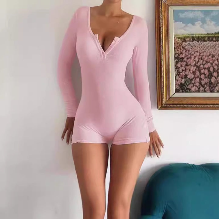 Damens kroppsnära långärmad jumpsuit med fina ribbdetaljer Mirla-Eva Jonsson