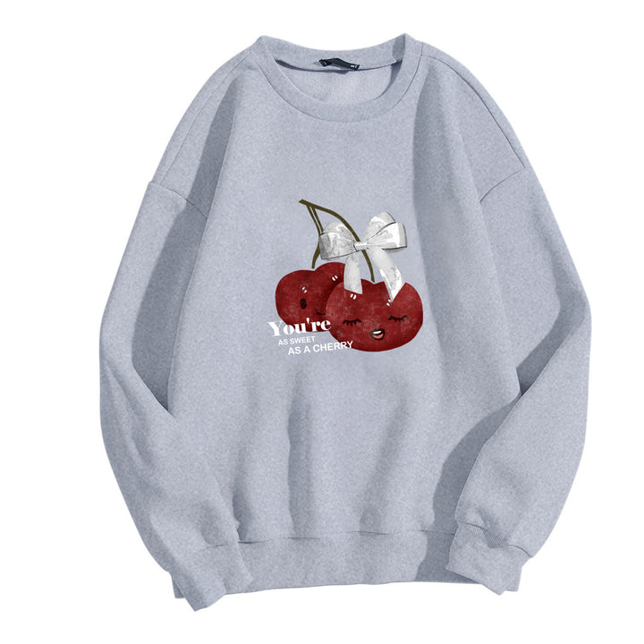 Damens mysiga sweatshirt med fruktig körsbärsmotiv Mirla-Eva Jonsson