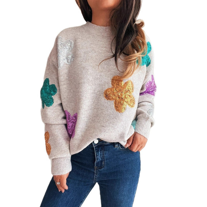 Damens stickad tröja med färgglada glittrande blommor Mirla-Eva Jonsson