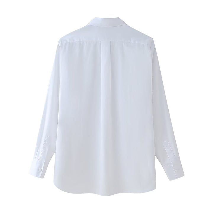 Damensmart designad blus med blomsterapplikationer Mirla-Eva Jonsson