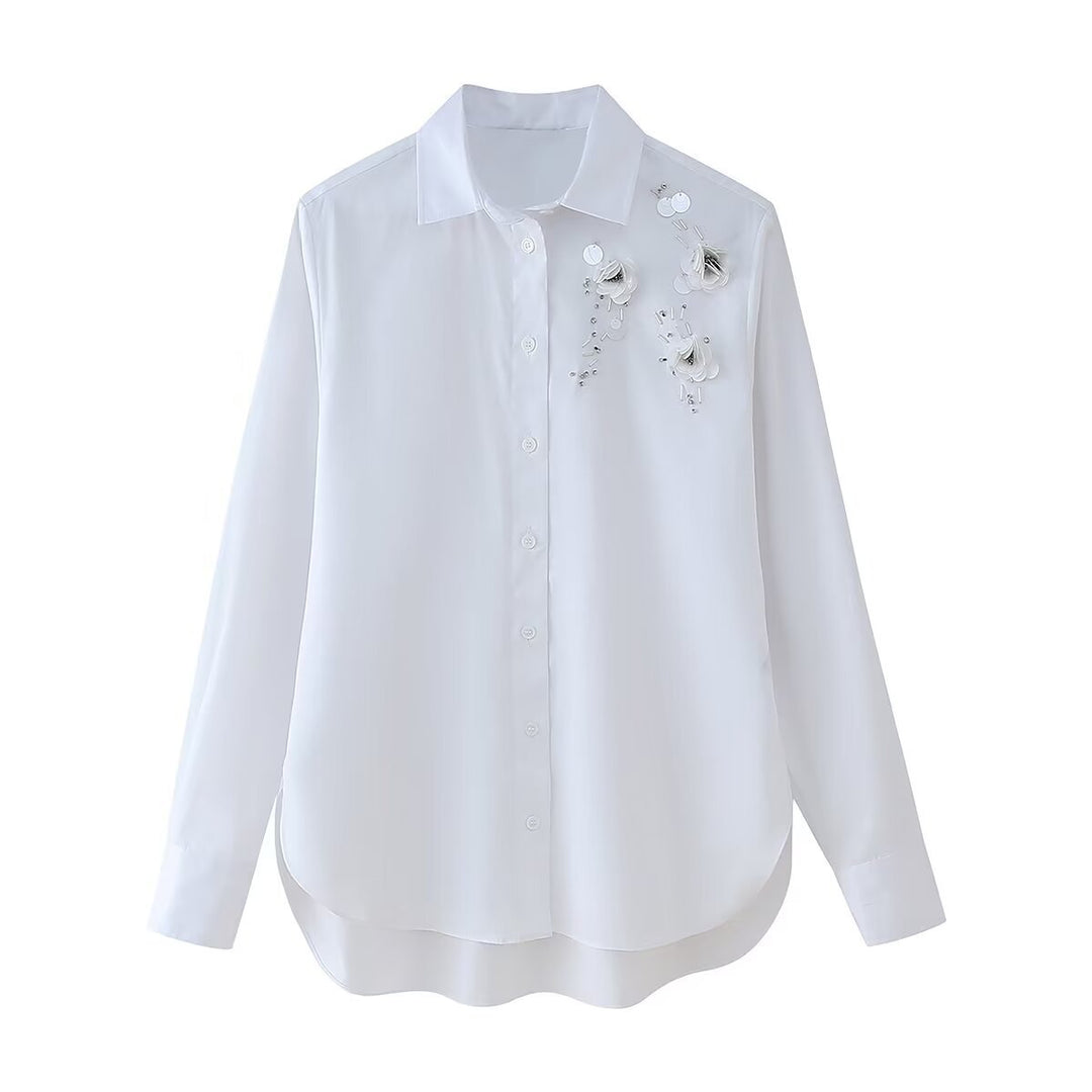 Damensmart designad blus med blomsterapplikationer Mirla-Eva Jonsson