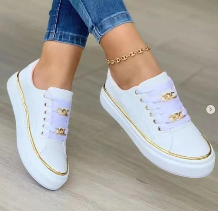 Damensneakers med modernt satintyg och eleganta guldfärgade accenter Mirla-Eva Jonsson