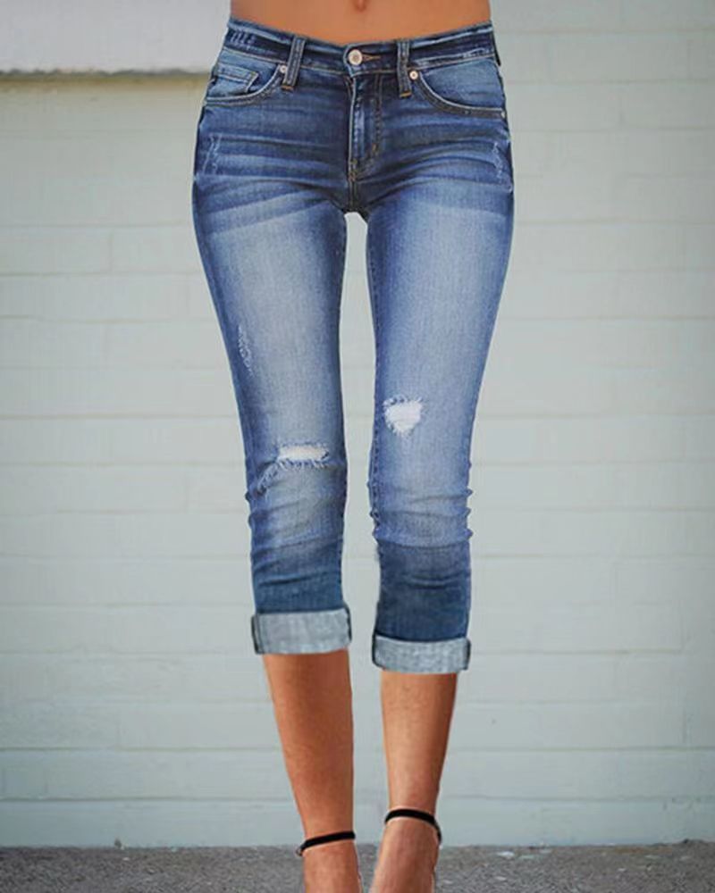 Damer 3/4 jeans med avslappnad passform och fransade fållar Mirla-Eva Jonsson
