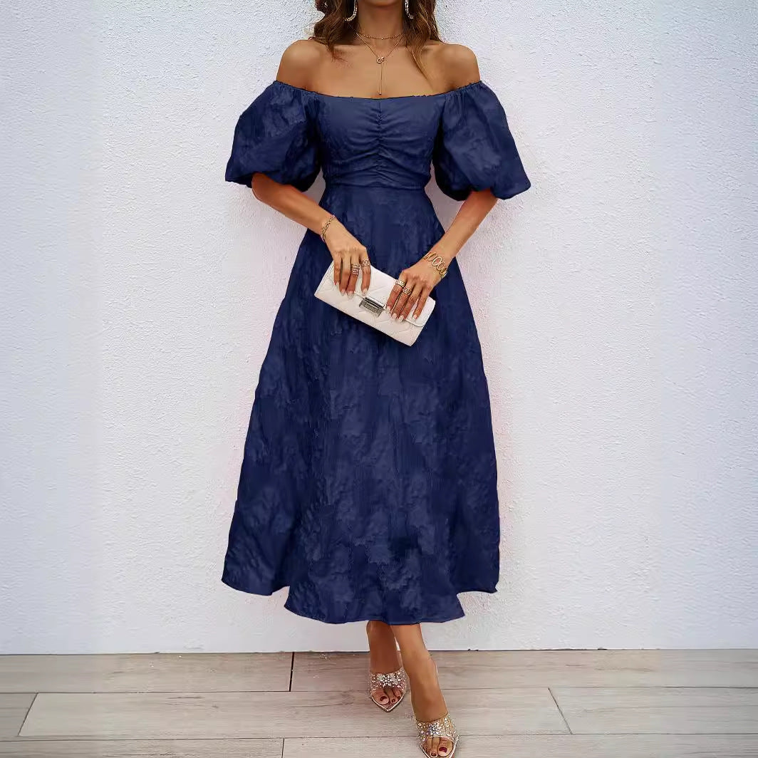 Damer A-linje maxi klänning med voluminösa puffärmar och blommönster Mirla-Eva Jonsson