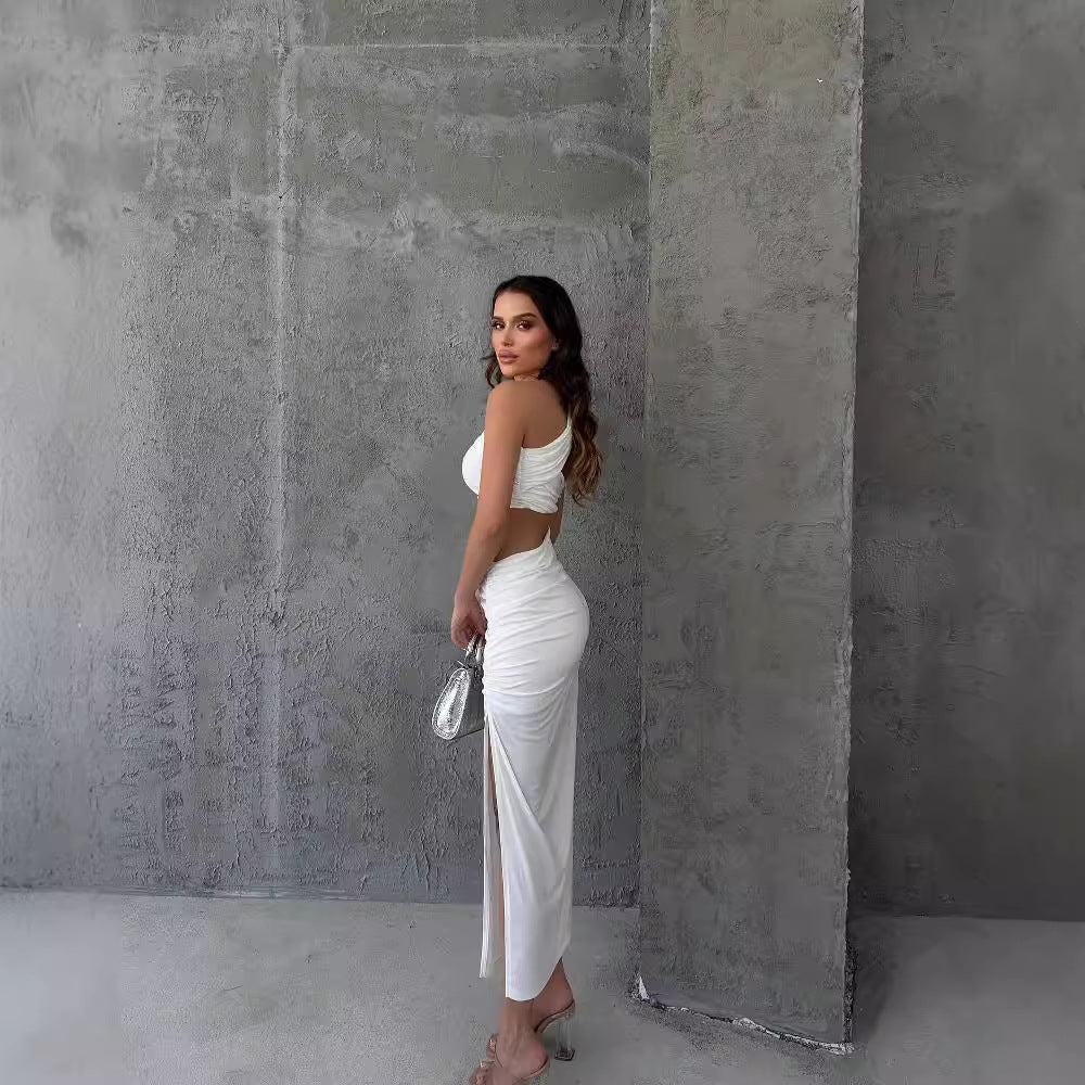 Damer Asymmetrisk Maxiklänning med cut-out-detaljer och raffinerade volangdetaljer Mirla-Eva Jonsson