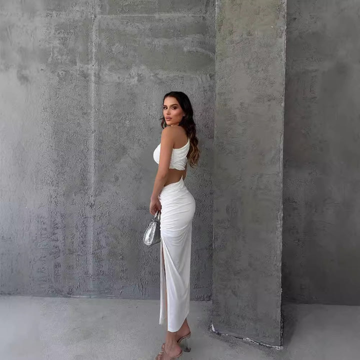 Damer Asymmetrisk Maxiklänning med cut-out-detaljer och raffinerade volangdetaljer Mirla-Eva Jonsson