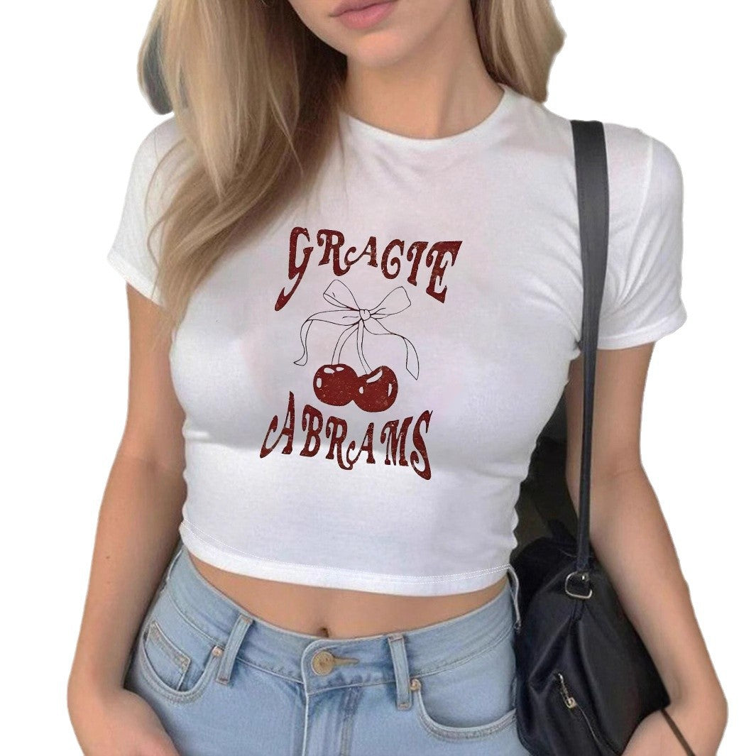 Damer Crop-T Shirt med slätt körsbärsmönster och lekfullt tryck Mirla-Eva Jonsson