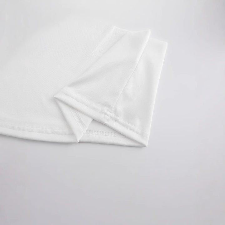 Damer Crop-T-shirt med lekfullt rutigt bandmotiv och avslappnad skärning Mirla-Eva Jonsson