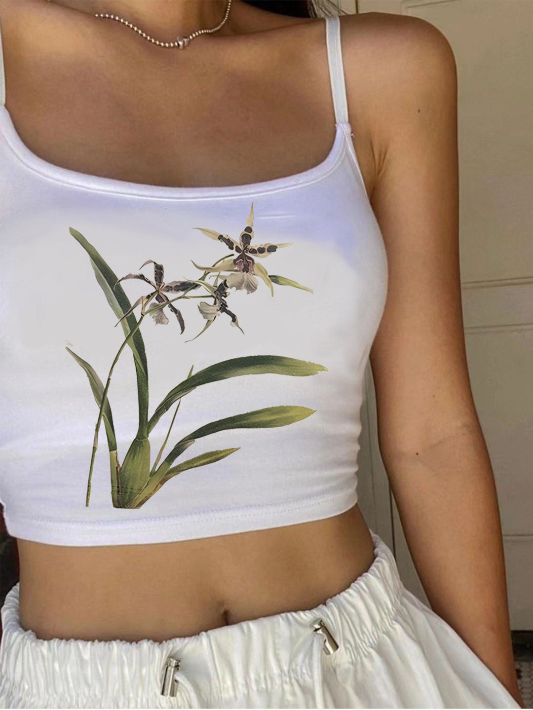 Damer Crop-Top med blommigt mönster och smala axelband Mirla-Eva Jonsson