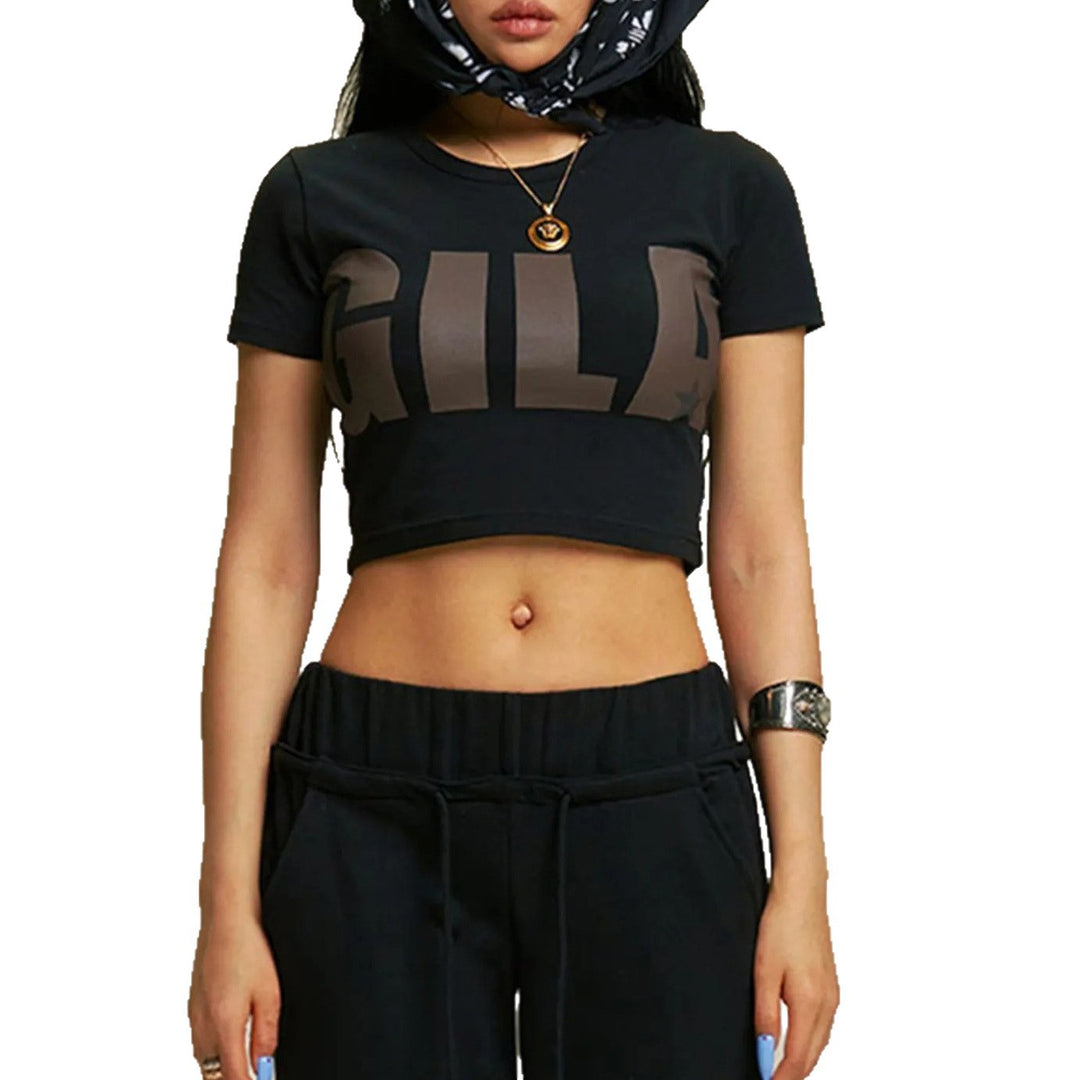 Damer Cropped T-shirt med iögonfallande grafiskt tryck Mirla-Eva Jonsson