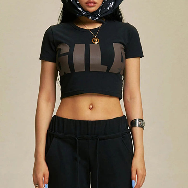 Damer Cropped T-shirt med iögonfallande grafiskt tryck Mirla-Eva Jonsson