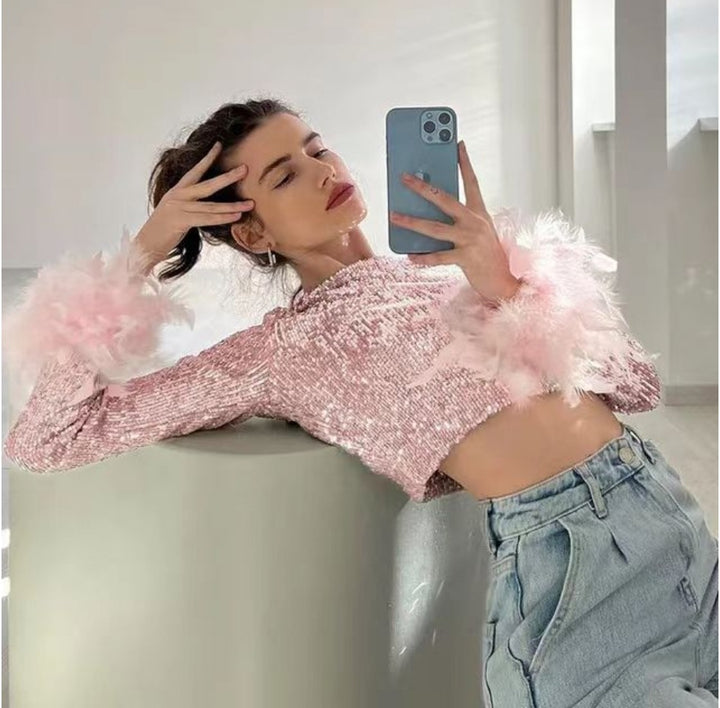 Damer Cropped topp med glittrande paljetter och fluffiga ärmslut Mirla-Eva Jonsson
