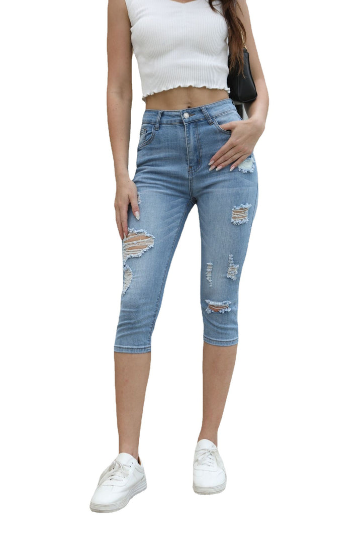 Damer Denim Capri-byxor med slitna detaljer och hög midja Mirla-Eva Jonsson