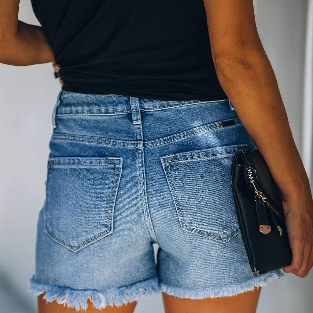 Damer Denim-Shorts i avslappnad förstörd look med hög midja och fransig fåll Mirla-Eva Jonsson