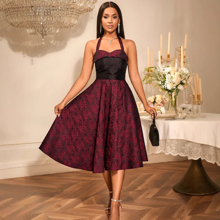 Damer Elegant Cocktailklänning med blommönster och smickrande midjebälte Mirla-Eva Jonsson