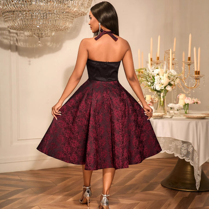 Damer Elegant Cocktailklänning med blommönster och smickrande midjebälte Mirla-Eva Jonsson