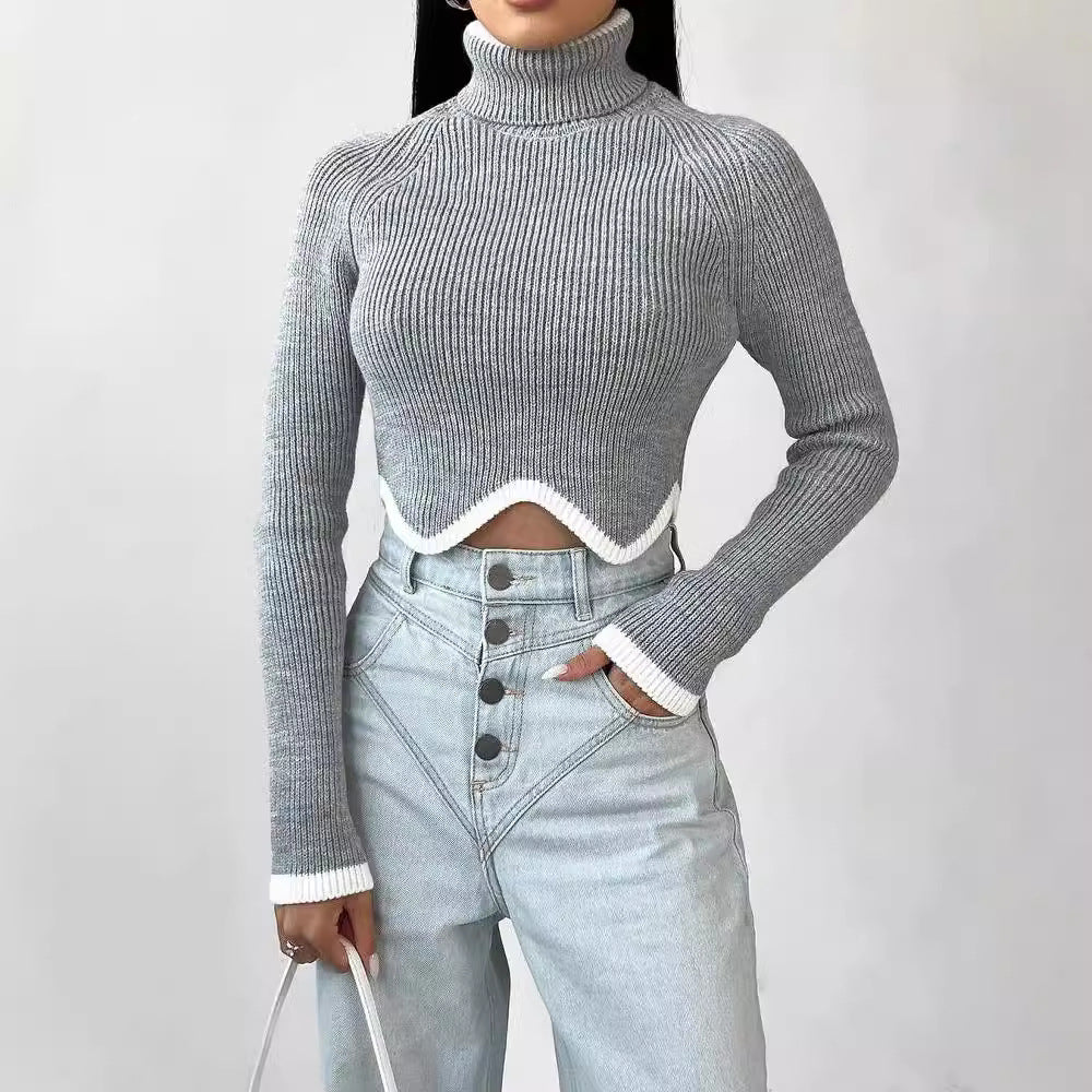 Damer Elegant Crop-Pullover med Rullkrage och Lekfull Nederkant Mirla-Eva Jonsson