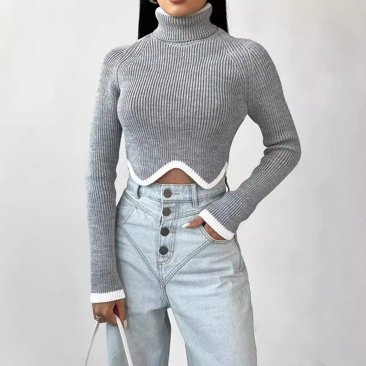 Damer Elegant Crop-Pullover med Rullkrage och Lekfull Nederkant Mirla-Eva Jonsson