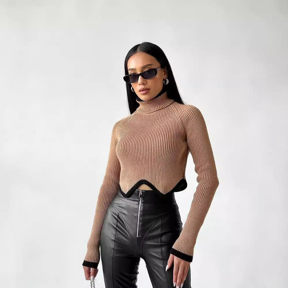 Damer Elegant Crop-Pullover med Rullkrage och Lekfull Nederkant Mirla-Eva Jonsson