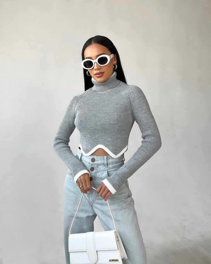 Damer Elegant Crop-Pullover med Rullkrage och Lekfull Nederkant Mirla-Eva Jonsson