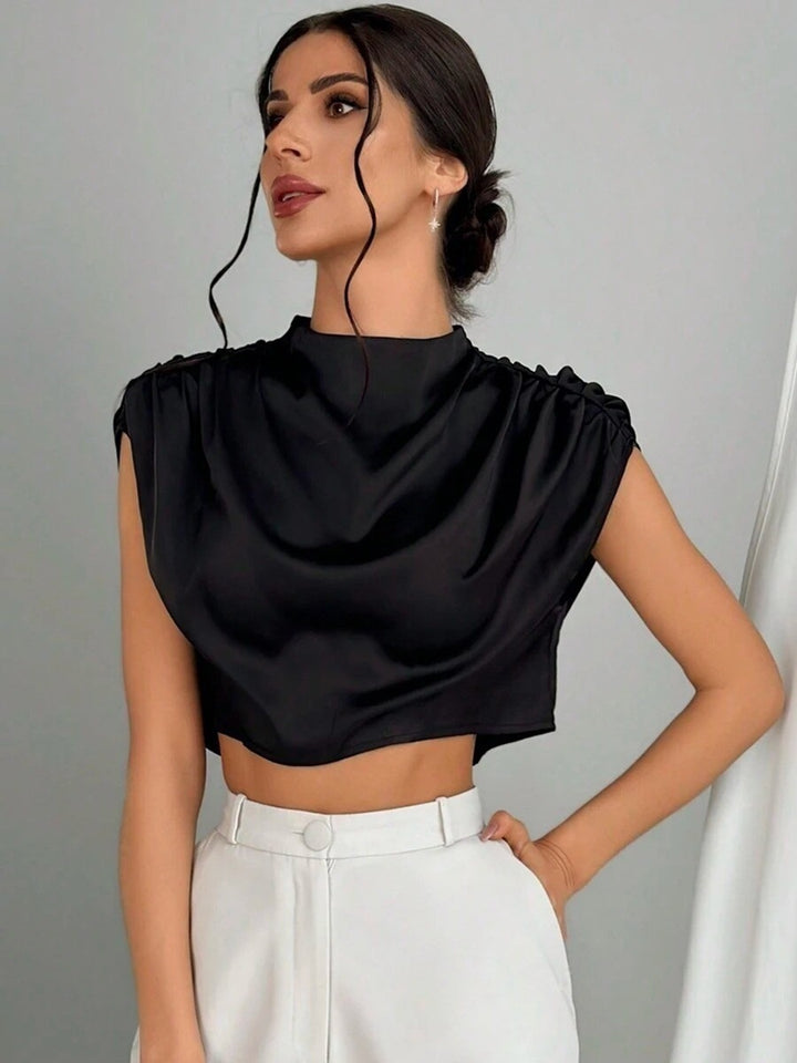 Damer Elegant Crop-Top med voluminösa ärmar och ädel ryggöppning Mirla-Eva Jonsson