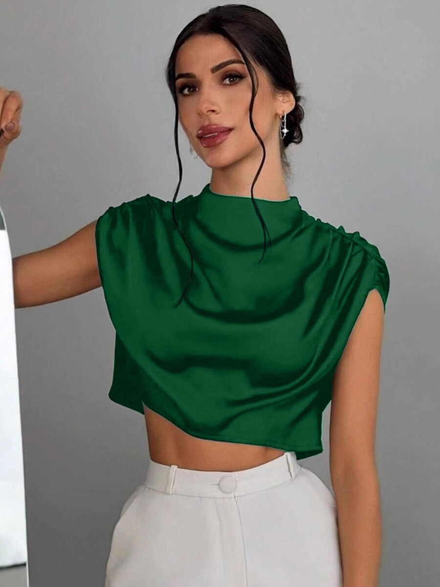 Damer Elegant Crop-Top med voluminösa ärmar och ädel ryggöppning Mirla-Eva Jonsson
