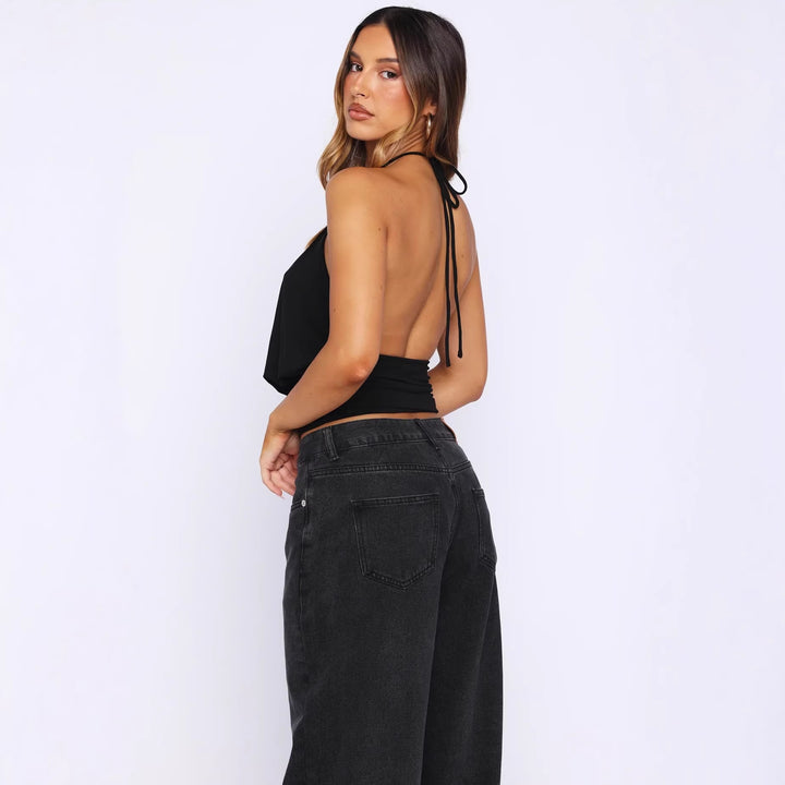 Damer Elegant Halterneck-top med sofistikerad U-ringning och dekorativ ringdetalj Mirla-Eva Jonsson