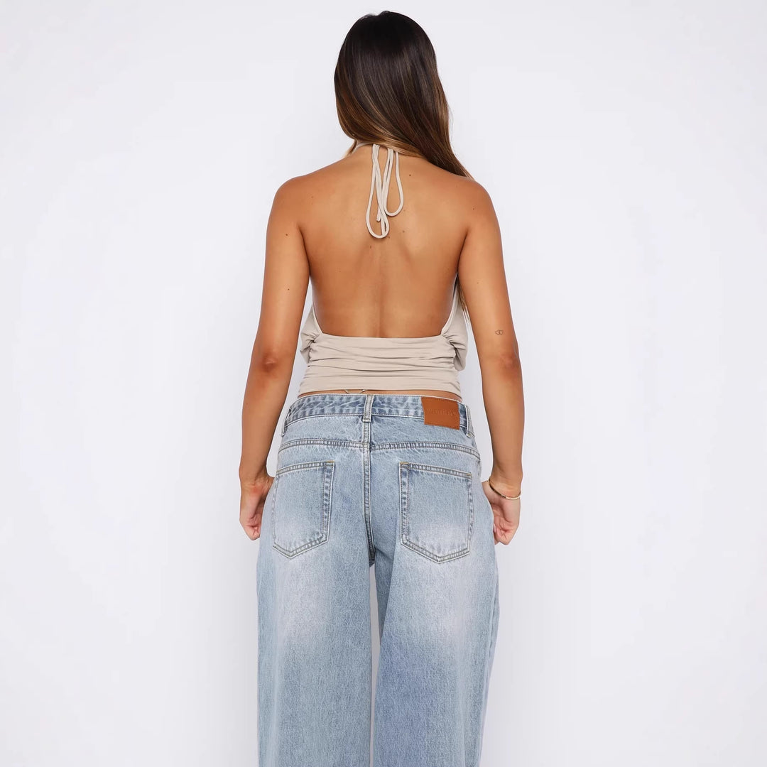 Damer Elegant Halterneck-top med sofistikerad U-ringning och dekorativ ringdetalj Mirla-Eva Jonsson