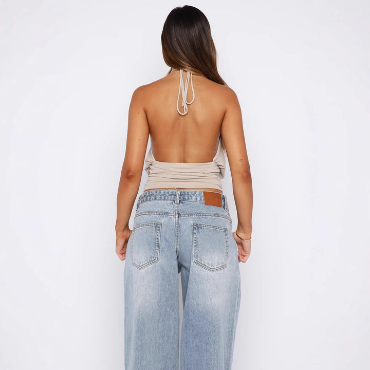 Damer Elegant Halterneck-top med sofistikerad U-ringning och dekorativ ringdetalj Mirla-Eva Jonsson
