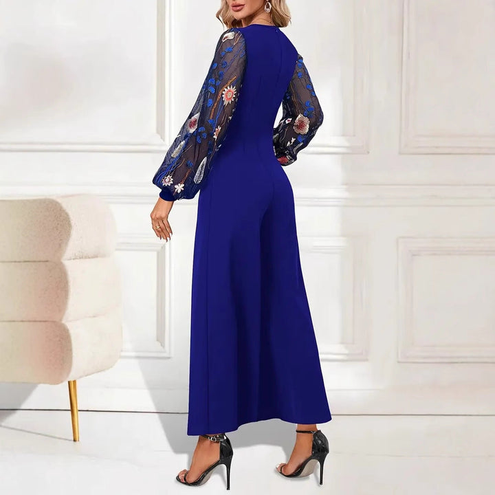 Damer Elegant Jumpsuit med Blommiga Spetsärmar och Vid Ben Mirla-Eva Jonsson