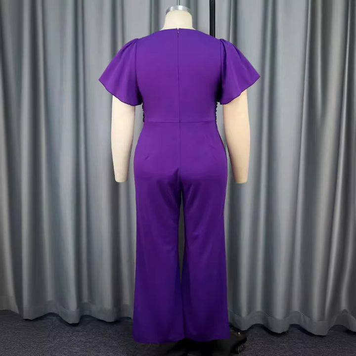 Damer Elegant Jumpsuit med asymmetrisk design och elegant bågapplikation Mirla-Eva Jonsson