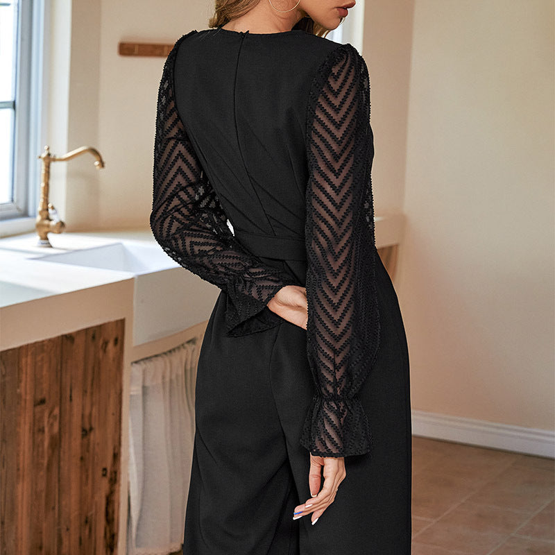 Damer Elegant Jumpsuit med justerbart bälte och transparent ärmdesign Mirla-Eva Jonsson
