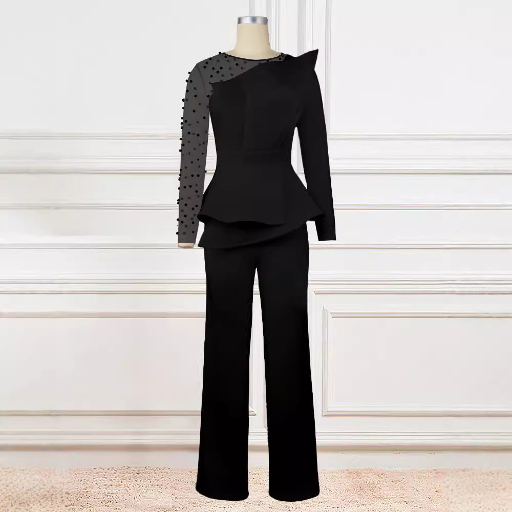 Damer Elegant Jumpsuit med transparenta puffärmar och djup V-ringning Mirla-Eva Jonsson