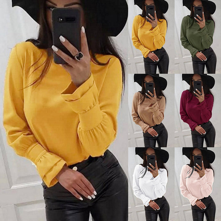 Damer Elegant Långärmad topp med moderiktiga puffärmar och fint materialmix Mirla-Eva Jonsson