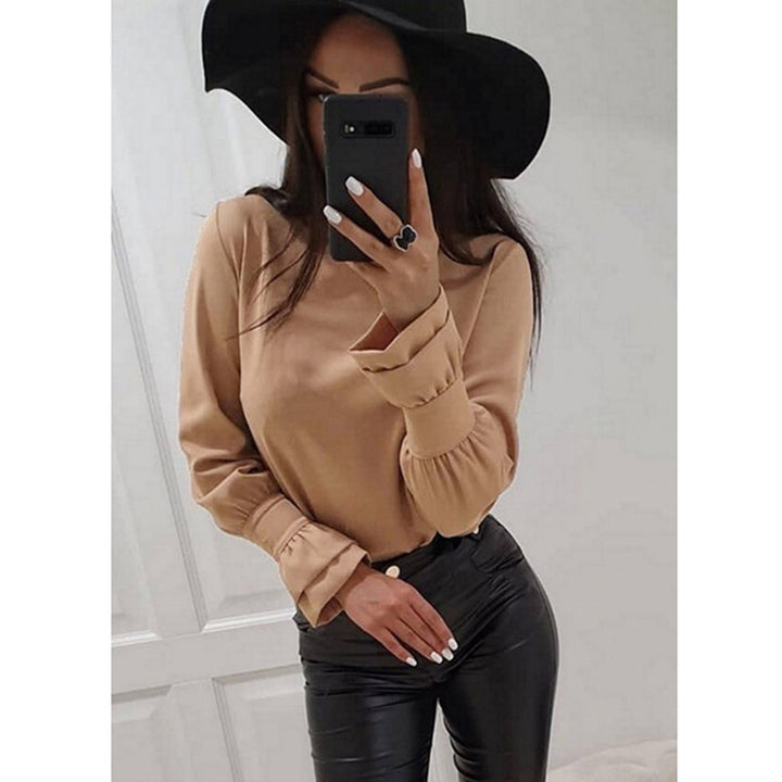 Damer Elegant Långärmad topp med moderiktiga puffärmar och fint materialmix Mirla-Eva Jonsson